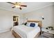 Relaxing bedroom with wooden bed frame, bedside tables, and view into bathroom at 9300 Lake Wheeler Rd, Fuquay Varina, NC 27526