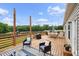 Spacious deck with an outdoor dining area, lounge seating, and a grill creates a perfect space at 9300 Lake Wheeler Rd, Fuquay Varina, NC 27526