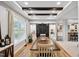 Well-lit dining room featuring decorative beams, a large window, and easy access to the kitchen at 9300 Lake Wheeler Rd, Fuquay Varina, NC 27526