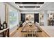 Charming dining room with a farmhouse table, decorative sliding doors, and plenty of natural light at 9300 Lake Wheeler Rd, Fuquay Varina, NC 27526