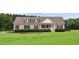 Charming home with manicured lawn, landscaping, and inviting front porch at 9300 Lake Wheeler Rd, Fuquay Varina, NC 27526