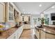 Bright kitchen with stainless appliances, granite counters, and a view to the backyard at 9300 Lake Wheeler Rd, Fuquay Varina, NC 27526