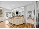 Open kitchen area featuring an island with counter seating, granite countertops and stainless steel appliances at 9300 Lake Wheeler Rd, Fuquay Varina, NC 27526