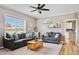 Comfortable living room with two gray sofas, ceiling fan, and neutral decor at 9300 Lake Wheeler Rd, Fuquay Varina, NC 27526