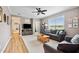Inviting living room with lots of light, featuring a gray sofa and wood accents at 9300 Lake Wheeler Rd, Fuquay Varina, NC 27526