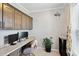 Bright office features custom cabinets, granite countertops, modern monitors and a comfortable workspace at 9300 Lake Wheeler Rd, Fuquay Varina, NC 27526
