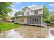 Exterior view of home, featuring a well-maintained lawn and screened-in back porch at 9425 Brimstone Ln, Raleigh, NC 27613