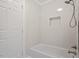 Bathroom with tiled shower and bathtub combination at 9425 Brimstone Ln, Raleigh, NC 27613