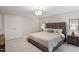 Comfortable bedroom features plush bedding, neutral tones, and matching nightstands at 9425 Brimstone Ln, Raleigh, NC 27613