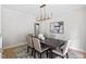 Dining room with modern chandelier and seating for six, perfect for Gathering dinners at 9425 Brimstone Ln, Raleigh, NC 27613