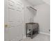 Functional laundry area features a stainless steel utility sink and convenient storage solutions at 9425 Brimstone Ln, Raleigh, NC 27613