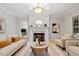 Inviting living room features a marble fireplace, stylish decor, and comfortable seating arrangement at 9425 Brimstone Ln, Raleigh, NC 27613