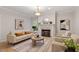 Cozy living room featuring a fireplace, comfortable seating, neutral color palette, and stylish decor at 9425 Brimstone Ln, Raleigh, NC 27613