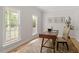 Bright office space featuring hardwood floors, natural light, and neutral walls at 9425 Brimstone Ln, Raleigh, NC 27613