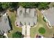 Aerial view of a home with mature landscaping and unique roof lines in a well-maintained neighborhood at 100 Sheraton Ln, Garner, NC 27529