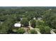 An aerial view of the neighborhood with many trees and greenery at 100 Sheraton Ln, Garner, NC 27529