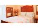 A comfortable bed is nestled between a nightstand and a door at 100 Sheraton Ln, Garner, NC 27529