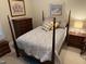 Cozy bedroom featuring a four-poster bed, dresser, and bedside table at 100 Sheraton Ln, Garner, NC 27529