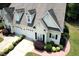 Stylish home showcasing a two-car garage, dormer windows, and manicured landscaping offering great curb appeal at 100 Sheraton Ln, Garner, NC 27529