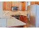 Bright kitchen featuring stainless steel appliances, granite countertops, and tiled backsplash at 100 Sheraton Ln, Garner, NC 27529