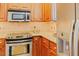 Bright kitchen featuring stainless steel appliances, granite countertops, and tiled backsplash at 100 Sheraton Ln, Garner, NC 27529