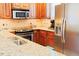 The Kitchen features light granite countertops and stainless steel appliances at 100 Sheraton Ln, Garner, NC 27529