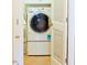 View of a white, front load washer and dryer at 100 Sheraton Ln, Garner, NC 27529