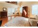 Bright living room with hardwood floors, high ceilings, large windows, a decorative rug, and stylish furniture at 100 Sheraton Ln, Garner, NC 27529