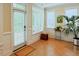 Bright sunroom with terracotta tile flooring, large windows for natural light, and ample space for plants at 100 Sheraton Ln, Garner, NC 27529