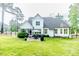 Spacious backyard with a patio, grill, and lush green lawn, perfect for outdoor activities at 104 Crosby Ln, Sanford, NC 27330