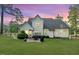 Spacious backyard featuring a patio area, manicured lawn, and privacy fence at 104 Crosby Ln, Sanford, NC 27330