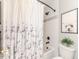 Bright bathroom with a tub, unique shower curtain, and modern fixtures at 104 Crosby Ln, Sanford, NC 27330