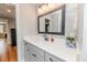 Elegant bathroom featuring a white quartz countertop and designer ceramic tile walls at 104 Crosby Ln, Sanford, NC 27330