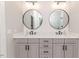 Elegant bathroom vanity with dual sinks, modern mirrors, and stylish fixtures at 104 Crosby Ln, Sanford, NC 27330