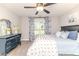 Charming bedroom with a ceiling fan, blue accents, and a blue antique dresser at 104 Crosby Ln, Sanford, NC 27330