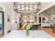 Bright dining area flowing into kitchen with a large island and modern appliances at 104 Crosby Ln, Sanford, NC 27330