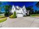 Charming home with a two-car garage, well-maintained lawn, and mature landscaping at 104 Crosby Ln, Sanford, NC 27330