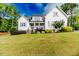 Well-manicured home exterior with lush lawn and tasteful landscaping in a desirable neighborhood at 104 Crosby Ln, Sanford, NC 27330