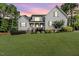 Charming home with a manicured lawn, classic architecture, and welcoming front porch at 104 Crosby Ln, Sanford, NC 27330