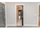 Hallway featuring hardwood floors and views into other rooms at 104 Crosby Ln, Sanford, NC 27330