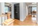 Hallway featuring dark accent doors with white trim at 104 Crosby Ln, Sanford, NC 27330