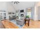 Bright living room boasting hardwood floors, a fireplace, and neutral tones creating a warm and inviting atmosphere at 104 Crosby Ln, Sanford, NC 27330