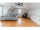 Inviting living room with hardwood floors, comfortable seating, and modern ceiling fan at 104 Crosby Ln, Sanford, NC 27330