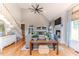 Spacious living room with hardwood floors, a fireplace, and a staircase adding architectural interest and charm at 104 Crosby Ln, Sanford, NC 27330