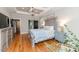 Spacious main bedroom featuring hardwood floors, a decorative ceiling, and light gray walls at 104 Crosby Ln, Sanford, NC 27330