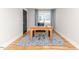 Bright home office featuring hardwood floors, a stylish rug, and a comfortable desk setup at 104 Crosby Ln, Sanford, NC 27330