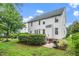 Exterior backyard view featuring mature trees, landscaping, grill, and deck at 106 Roundtop Rd, Cary, NC 27519