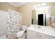 Cozy bathroom featuring a shower, toilet, and sink with ample lighting for a functional space at 106 Roundtop Rd, Cary, NC 27519