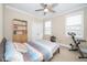 Bedroom with carpeted floor, ceiling fan, and natural light from the windows at 106 Roundtop Rd, Cary, NC 27519