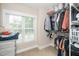 Organized walk-in closet with ample storage space, shelving, and a window for natural light at 106 Roundtop Rd, Cary, NC 27519